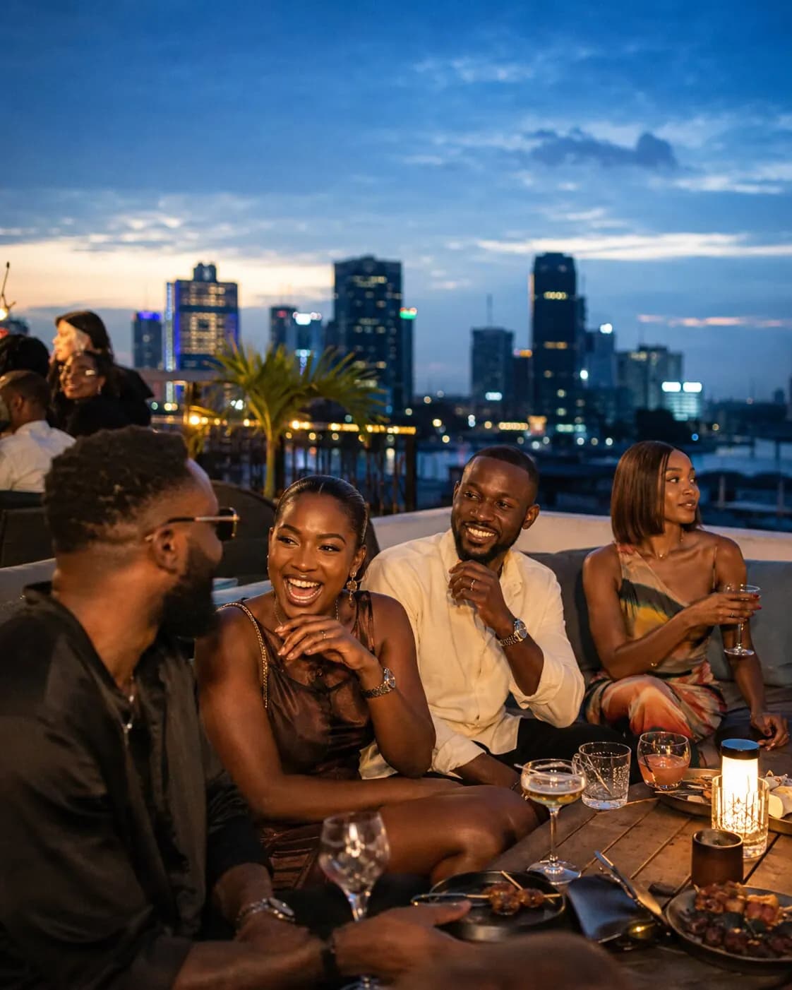 Lagos skyline glowing over an evening experience